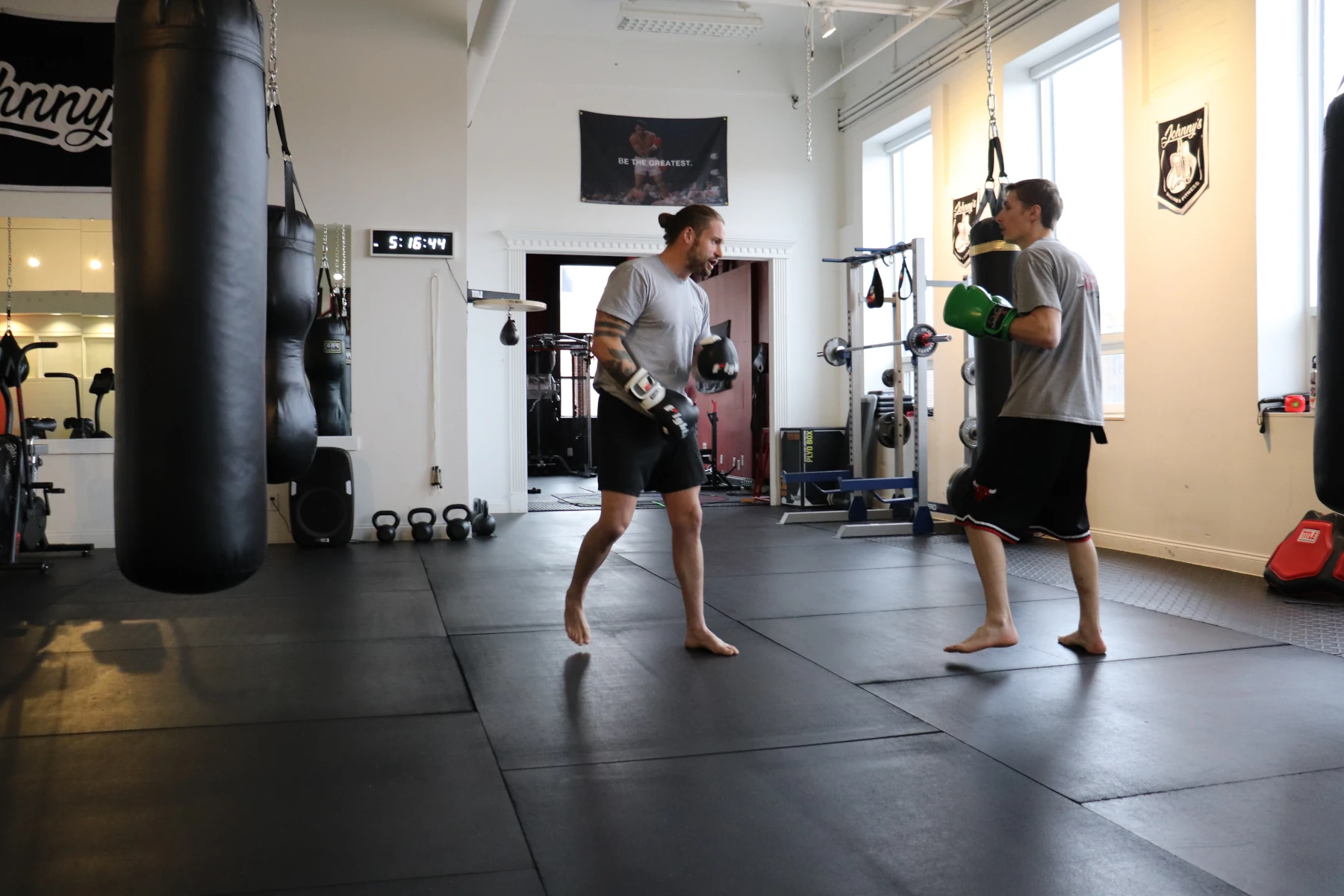 Coach Johnny teaching a boxer