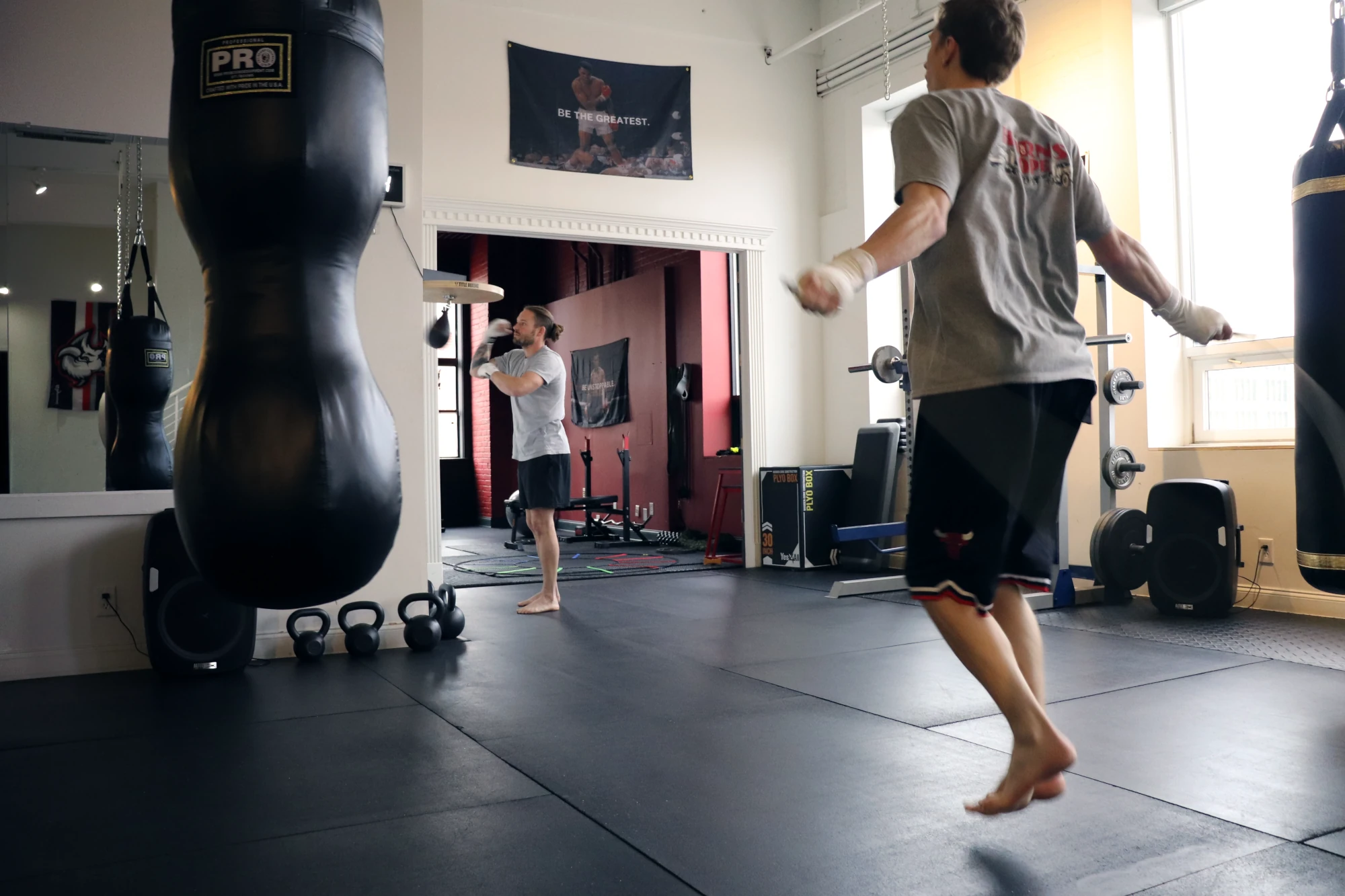 Boxers Jumping Rope and hitting speed bag